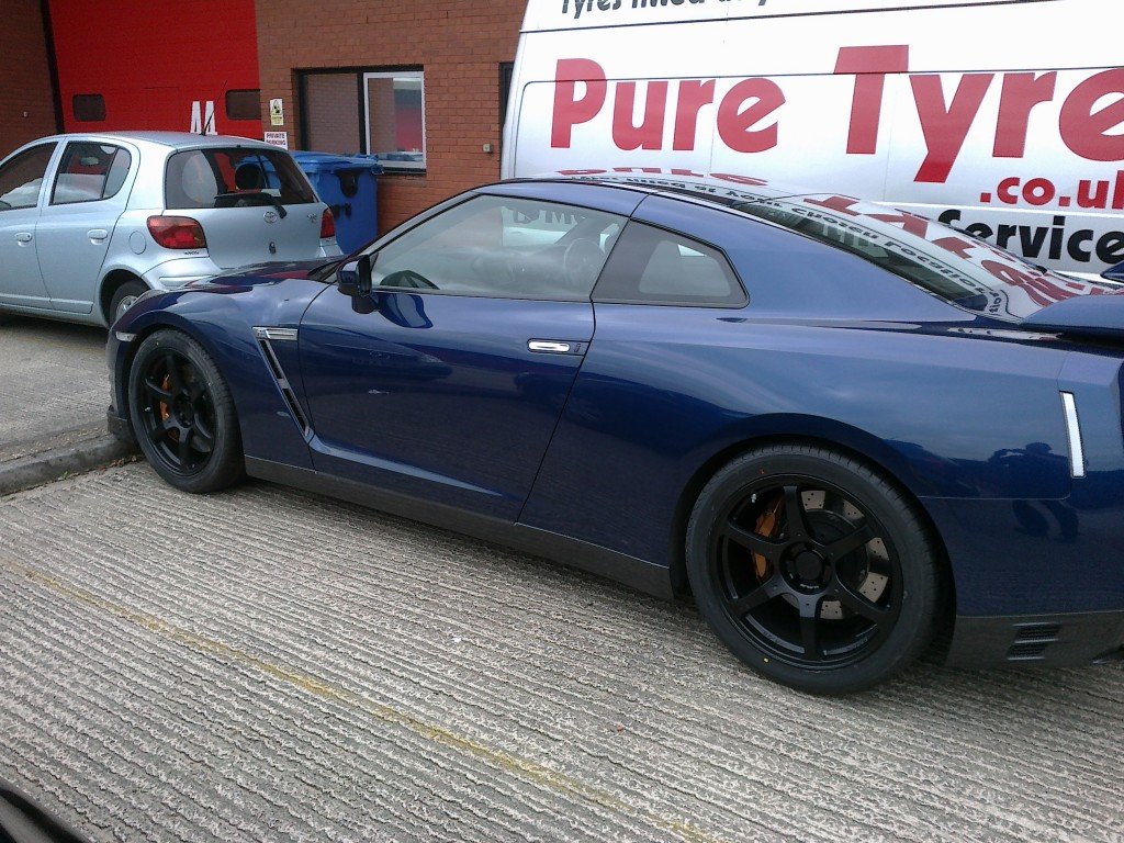 Pure tyre van behind a nissan gtr